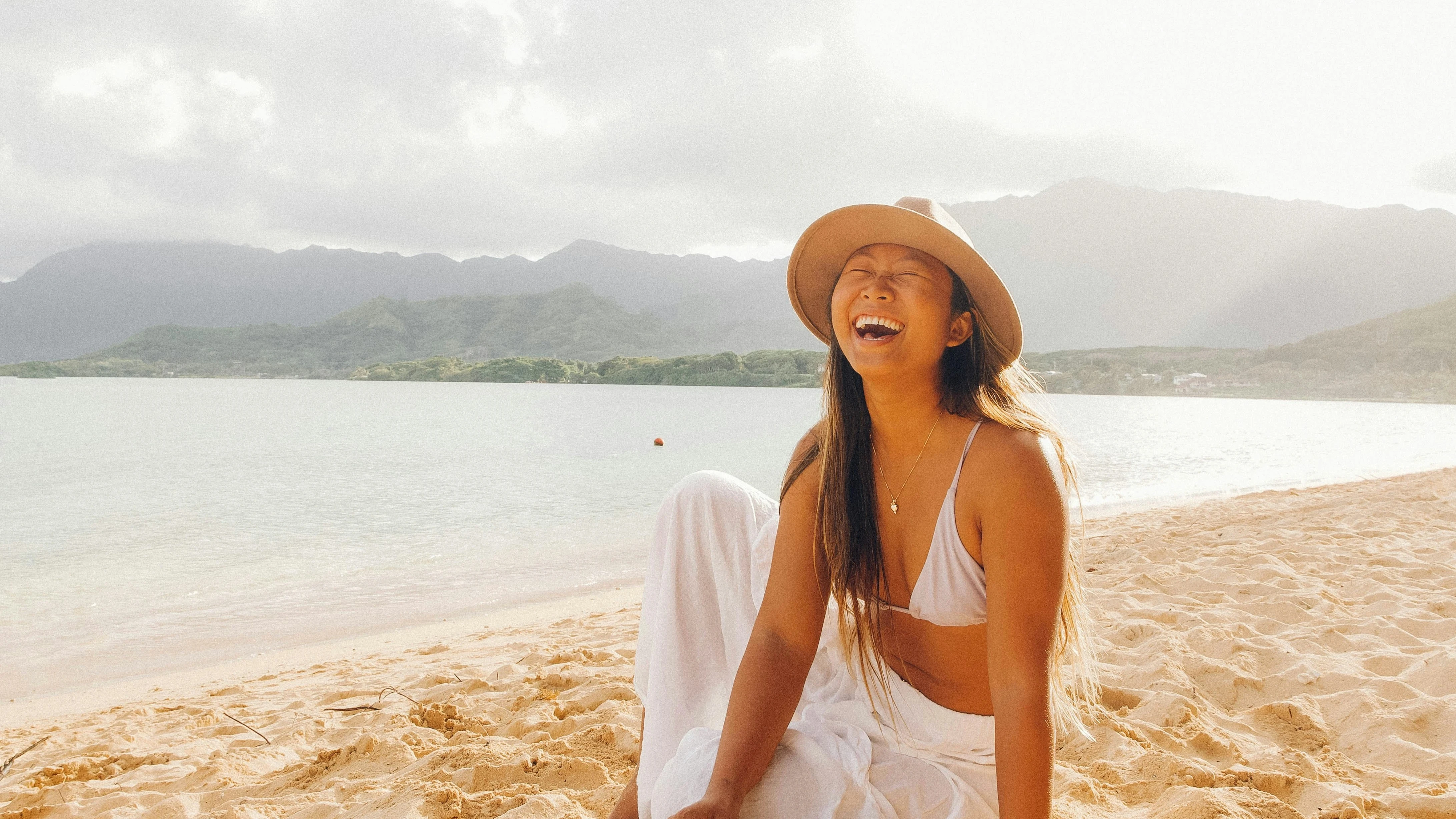A happy woman in the beach